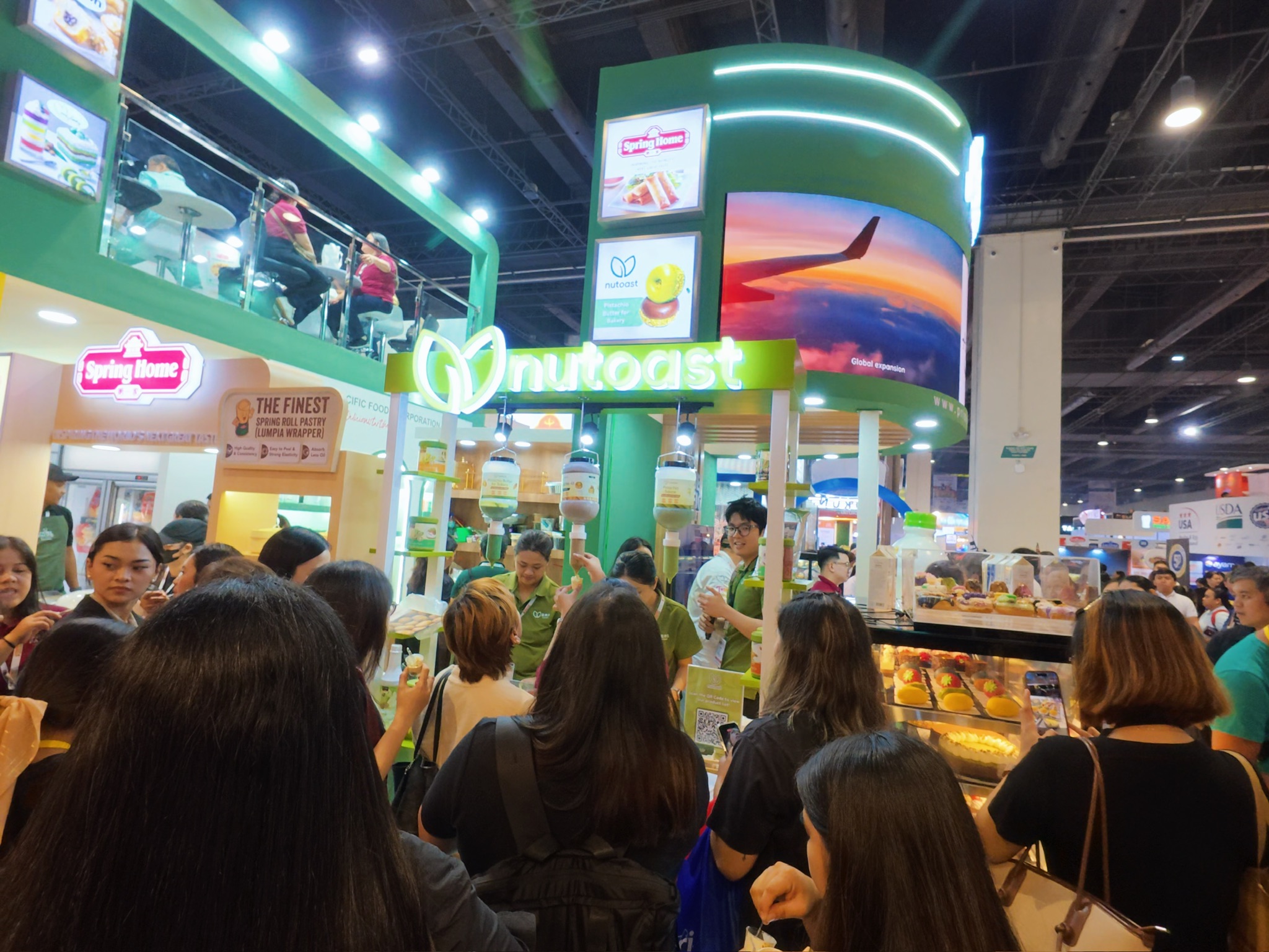 Visitors gathering around the Nutoast booth at WOFEX 2026.